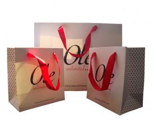 Buy cheap Custom Printed White Paper Gift Bags Wholesale Spot UV Logo Ribbon Handle product