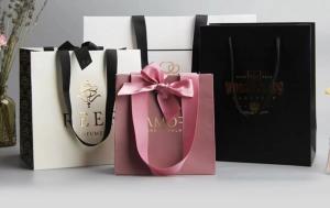 Buy cheap Apparel Smoky Printed Paper Shopping Bags C2S Artpaper Ribbon Handle Gift Bags product
